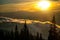 Beautiful sunrise in mountain forest with magical sky on background