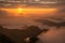 Beautiful sunrise over highland mountains view from Phu Chi Dao located in Chiang Rai province of Thailand.