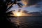 Beautiful Sunrise over the ocean with waves moving to rocky Beach on the Molokai