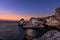 Beautiful sunrise over Rocky ocean beach.