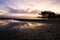 Beautiful sunrise over tropical sandy beach, magical sunlight and reflection