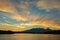 Beautiful sunrise over volcanoes Kluchevskaya group with reflection in the river Kamchatka.