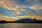 Beautiful sunrise over volcanoes Kluchevskaya group with reflection in the river Kamchatka.