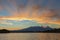 Beautiful sunrise over volcanoes Kluchevskaya group with reflection in the river Kamchatka.