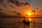 Beautiful sunrise scenery with Jukung is traditional balinese fishing boats at Karang Beach, Sanur, Bali, Indonesia