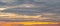 Beautiful sunrise sky. Golden, grey, and white sky. Colorful sunrise. Art picture of sky at sunrise. Sunrise and clouds for
