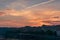 Beautiful sunrise sky with streaks from airplane condensation trails