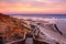 A beautiful sunrise at southport port noarlunga south australia overlooking the wooden staircase ocean and cliffs on the 30th