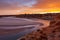 A beautiful sunrise at southport port noarlunga south australia overlooking the wooden staircase ocean and cliffs on the 30th