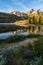 Beautiful sunrise at Stanley Lake in the Sawtooth Mountains of Idaho. Reflection in water with wildflowers