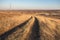 Beautiful Sunrise in the steppe over dirt road.