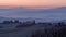 Beautiful sunrise on the Tuscan hills between San Quirico d`Orcia and the Rocca di Radicofani, Siena, Italy