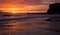 A beautiful sunrise at Tynemouth`s King Edward`s Bay, as the sky explodes with color
