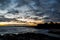 A beautiful sunrise at Tynemouth`s King Edward`s Bay with the sunlight catching the underside of the clouds