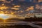 A beautiful sunrise at Tynemouth`s King Edward`s Bay with the sunlight catching the underside of the clouds