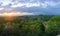 A beautiful sunrise view of the Tikal Ruins and Temple IV in Tikal National Park, Guatemela, with howler monkeys making loud