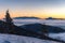 Beautiful sunrise in winter Little Fatra mountains above low clouds