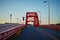 Beautiful sunset ahead of a red color bridge in Japan