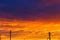 Beautiful sunset. Antennas and pipes at sunset. Layered rain clouds. Bright blue orange background. The texture of the sunset.