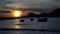 Beautiful sunset on the beach with boats and very colorful on the beach of Alicante, Spain