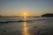 Beautiful sunset on a beach with fishing boats at the bottom, Ca