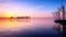 A Beautiful Sunset Blanketing a Fog-Kissed Lake in Radiant Hues