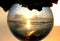 Beautiful sunset captured through a glass lens ball at Cape Henlopen State Park, Lewes, Delaware, U.S.A