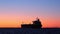 Beautiful sunset clip of a tanker ship sailing on a calm shipping channel between the Gulf of Mexico and a Corpus Christi, Texas