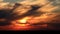 Beautiful sunset in clouds above horizon time lapse
