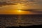 A beautiful sunset on the coast of Costa Adeje with in the distance the outline of the island of La Gomera, Tenerife, Spain