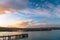 Beautiful sunset at the dock. Blue sky and Ocean with town view. Omaru, New Zealand