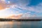 Beautiful sunset at the dock. Blue sky and Ocean with town view. Omaru, New Zealand