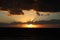 Beautiful sunset on the gulf of mexico.  beautiful orange golden sunset over the ocean.  the sun set through the clouds on the sea