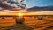 Beautiful Sunset Illuminating A Field Of Freshly Baled Hay