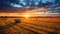 Beautiful Sunset Illuminating A Field Of Freshly Baled Hay