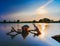 Beautiful sunset in The Lake With Classic Fishing Boat in Indonesia