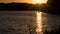 Beautiful sunset on the lake, fishermen on the boat