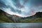 Beautiful sunset landscape image of Llyn Idwal and Devil`s Kitch