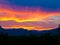 Beautiful sunset with the landscape of majorca with the tramuntana mountains in the background