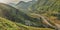 Beautiful sunset landscape with small houses on hillside with rice terraces after rice harvesting on the banks of a mountain river