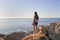 beautiful sunset, latin woman, panoramic view, comet point, huatulco Mexico