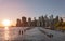 Beautiful Sunset and Lower Manhattan skyline with East River and New York City. Twilight with Reflections