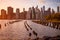 Beautiful Sunset and Lower Manhattan skyline with East River and New York City. Twilight with Reflections