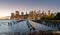 Beautiful Sunset and Lower Manhattan skyline with East River and New York City. Twilight with Reflections