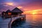 Beautiful sunset at Maldives with wooden jetty and water bungalows, Water bungalow. Sunset on the islands of the Maldives. A place