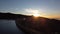 The beautiful sunset in the Maques da Silva Dam with water and rock in the Serra da Estrela Natural Park in Portugal