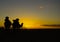 Beautiful sunset in Mongolia`s steppe with the shapes of a group of camel