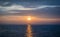 beautiful sunset on the ocean with offshore oil and gas platform,