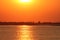 Beautiful sunset with an orange sky at the westerschelde in holland in summer