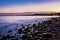 A beautiful sunset over the Baltic Sea, in the distance a pier in Gdynia. Poland